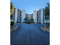 Exterior of building with parking and landscaping at 417 S Dunes Dr., Pawleys Island, SC 29585