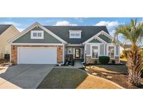 Attractive one-story home with stone and siding accents, landscaped yard at 569 Miromar Way, Myrtle Beach, SC 29588