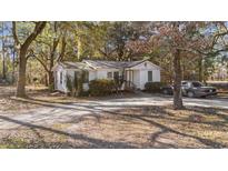 White house exterior with car parked in front and leafy surroundings at 3519 Cates Bay Hwy., Conway, SC 29527