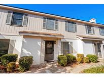 Inviting townhouse exterior, featuring a well-maintained facade and landscaping at 409 77Th Ave. N # B, Myrtle Beach, SC 29572