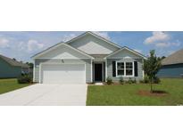 Gray house with white garage door and landscaping at 536 Duvall St., Longs, SC 29568