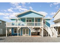 Charming blue beach cottage with wrap-around porch and elevated deck at 5607 N N Ocean Blvd., North Myrtle Beach, SC 29582