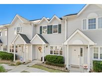 Charming townhome featuring a welcoming entrance and well-maintained landscaping at 618 3Rd Ave. S # 4D, North Myrtle Beach, SC 29582