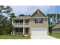 Two-story house with a neutral exterior, a front porch, and a two-car garage at 736 Rupert Dr, Conway, SC 29526