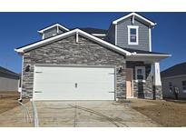 Two-story home with stone accents and a two-car garage at 847 Cypress Preserve Circle, Longs, SC 29568