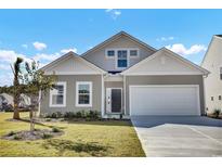 Two-story house with gray siding, two-car garage, and landscaped lawn at 888 Agostino Dr., Myrtle Beach, SC 29579