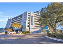 Low angle view of the condo exterior, showing the building, balconies, and surrounding trees at 2100 Sea Mountain Hwy. # 630, North Myrtle Beach, SC 29582