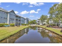 Waterfront community with buildings, picnic tables, and a playground at 5905 S Kings Hwy. # 6312, Myrtle Beach, SC 29575