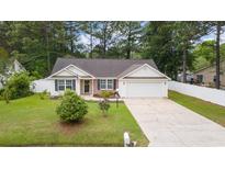 Charming one-story home with well-maintained lawn and an attached two-car garage at 5933 Rahnavard Blvd., Myrtle Beach, SC 29588