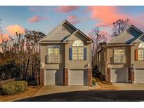 Attractive two-story townhome with two-car garage and a lovely sunset view at 670 2Nd Ave. N, North Myrtle Beach, SC 29582