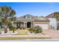 Beautiful house with stone accents and palm trees at 1625 Crosswinds Ave., North Myrtle Beach, SC 29582