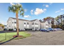 Condo building with ample parking and landscaping at 1943 Bent Grass Dr. # H, Myrtle Beach, SC 29575