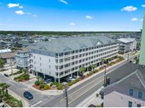 Aerial view of a large building with parking and landscaping at 200 53Rd Ave. N # 501, North Myrtle Beach, SC 29582