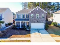 Two-story brick home with attached garage and front porch at 2998 Skylar Dr., Myrtle Beach, SC 29577