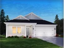 One-story home with white siding, a two-car garage, and a neatly landscaped lawn at 3091 Dover Branch Dr., Little River, SC 29566