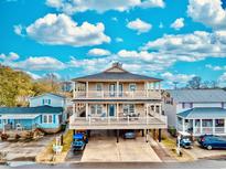 Elevated view of a two-story beach house with large deck at 6001 - 6004 S Kings Hwy., Myrtle Beach, SC 29575