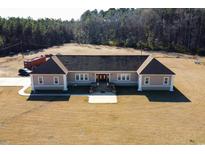 Single-story home with a large yard and ample parking at 798 Blue Sky Rd, Loris, SC 29569