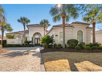 Elegant home with palm trees, driveway, and manicured landscaping at 8058 Verona Dr., Myrtle Beach, SC 29572