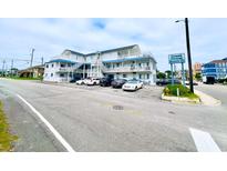 Grand Strand Resort III building exterior, ample parking at 1524 S Ocean Blvd. S # Penthouse, North Myrtle Beach, SC 29582