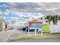 A Peace at the Beach V oceanfront condo building with parking and a view of the ocean at 191 Maison Dr. # B206, Myrtle Beach, SC 29572