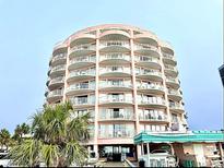 Oceanfront building, multiple stories, balconies, and palm trees at 201 70Th Ave. N # 609, Myrtle Beach, SC 29572