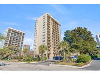 Modern high-rise condo building featuring private balconies and lush landscaping at 210 75Th Ave N # 4010, Myrtle Beach, SC 29572