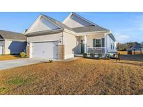 One-story house with a large front yard, attached garage, and front porch at 3009 South Bay St., Georgetown, SC 29440