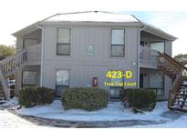 Snow covered exterior of a two story building with two staircases at 423 Tree Top Ct. # 23-D, Myrtle Beach, SC 29588