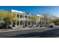 Brick townhouses with white columns and porches, located on a tree-lined street at 965 Hackler St. # C, Myrtle Beach, SC 29577