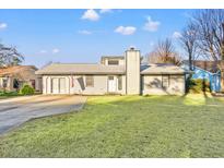 Ranch style home with a large yard and driveway at 1010 Shem Creek Circle, Myrtle Beach, SC 29588