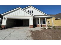 Charming new construction with two-car garage and covered porch at 1245 Crested Iris Way, North Myrtle Beach, SC 29582