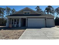 New construction home with gray siding, white trim, and a two-car garage at 35 Northbrook Dr, Murrells Inlet, SC 29576