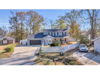 Two-story house with attached garage and fenced yard at 404 Cedar Run Dr., Myrtle Beach, SC 29588