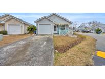 Cute cottage with attached garage and small front yard at 412 Chesterfield Ct., Myrtle Beach, SC 29577