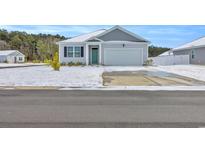 Gray house with a green door and snowy front yard at 426 Toledo St., Conway, SC 29526