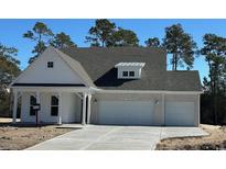 Charming new construction home with a two-car garage and stylish brick and siding exterior at 45 Northbrook Dr, Murrells Inlet, SC 29576