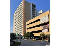 Oceanfront Sands Ocean Club building with parking and signage at 9550 Shore Dr. # 1132, Myrtle Beach, SC 29572