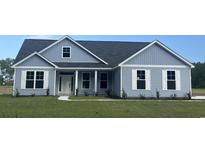 Newly constructed home with gray siding and a white trim at Tbd Hodges Rd., Conway, SC 29527