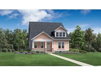 Charming one-story home boasts a manicured lawn and inviting front porch at 1816 Tryon Dr, Myrtle Beach, SC 29588