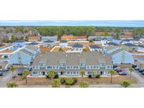 Aerial view of townhouses with community pool and ample parking at 1890 Colony Dr. # 17-G, Surfside Beach, SC 29575