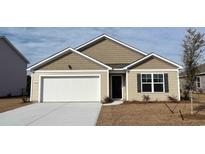 Charming single-story home with a two-car garage and manicured lawn at 6008 Fuller Ridge Ct, Conway, SC 29526