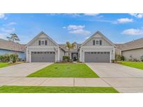 Two-story craftsman style home with gray siding, and two-car garage at 6076 Campanella St., Myrtle Beach, SC 29577