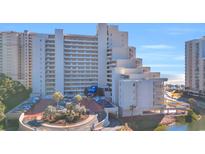Oceanfront building with ample parking and beautiful landscaping at 100 Ocean Creek Dr. # F-1, Myrtle Beach, SC 29572