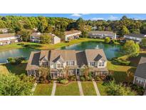 Aerial view of townhouses with a pond at 1010 Pinnacle Ln. # 1010, Myrtle Beach, SC 29577