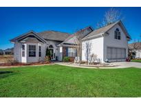 Charming one-story house with a two-car garage and well-manicured lawn at 1579 Southwood Dr., Surfside Beach, SC 29575