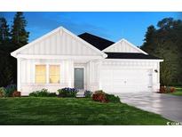 Charming one-story home with white siding, gray door, and two-car garage at 4319 Falls Oaks St., Myrtle Beach, SC 29579