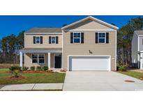 Two-story house with beige siding, white garage door, and landscaping at 511 Firouz Dr, Longs, SC 29568