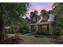 Charming home with a large porch, manicured landscaping, and inviting curb appeal at 512 Goff Creek Ct., Myrtle Beach, SC 29579