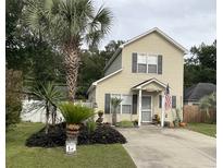 Charming two-story house with landscaped yard and walkway at 804 Brenda Pl., Myrtle Beach, SC 29577
