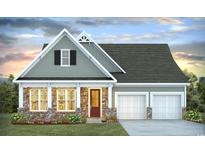 Two-story craftsman style home with stone accents and a two-car garage at 9000 Chesterfield Dr., Calabash, NC 28467